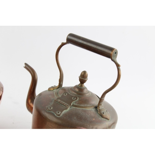 484 - Four various copper kettles to include two 19th century Soutterware examples