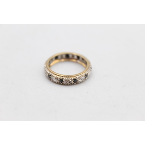 15 - A 9ct gold diamond and sapphire full eternity ring, size N - approx. gross weight 2.6 grams