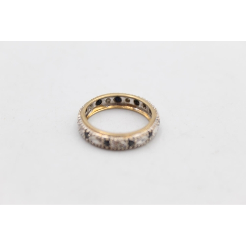 15 - A 9ct gold diamond and sapphire full eternity ring, size N - approx. gross weight 2.6 grams