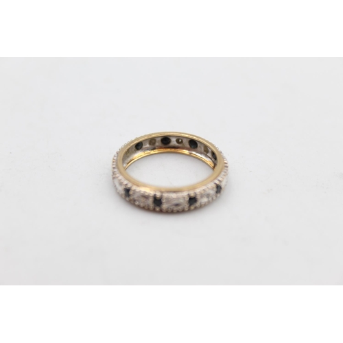 15 - A 9ct gold diamond and sapphire full eternity ring, size N - approx. gross weight 2.6 grams