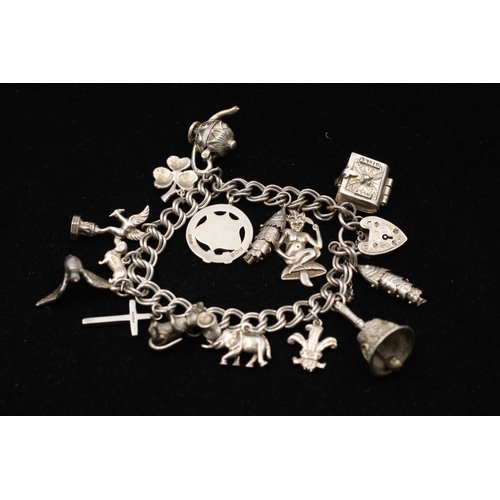 153 - A 925 sterling silver charm bracelet with heart padlock - approx. gross weight 56 grams and 15cm lon... 