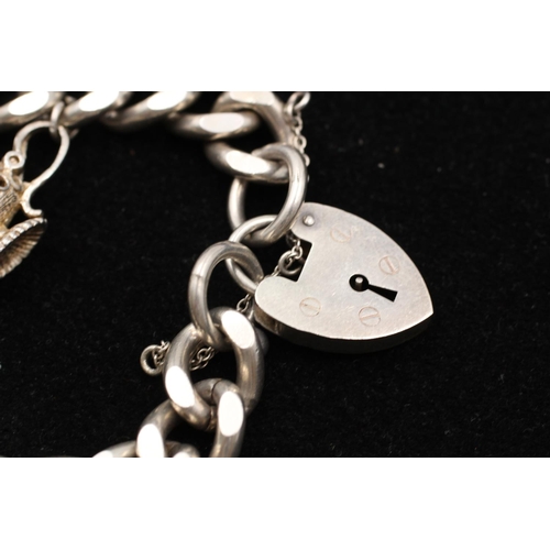 155 - A 925 sterling silver heart padlock horse lamp curb link charm bracelet - approx. gross weight 72 gr... 