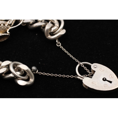 155 - A 925 sterling silver heart padlock horse lamp curb link charm bracelet - approx. gross weight 72 gr... 