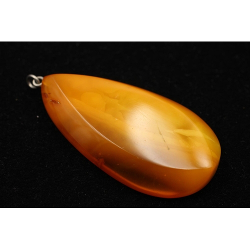 164 - Three 925 sterling silver amber pendants to include cabochon, butterscotch and pear