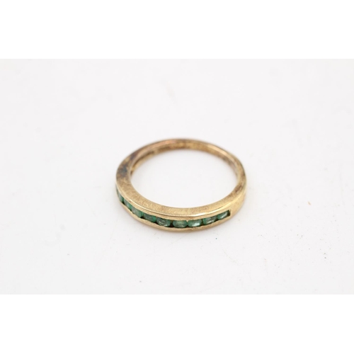 169 - Two 925 sterling silver rings, one being an emerald half eternity band, size P and one size O