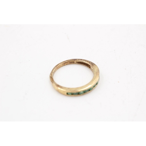 169 - Two 925 sterling silver rings, one being an emerald half eternity band, size P and one size O