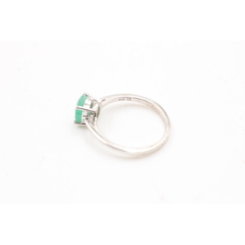 169 - Two 925 sterling silver rings, one being an emerald half eternity band, size P and one size O