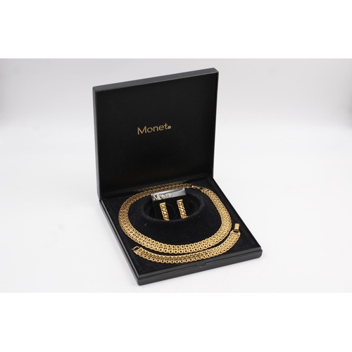 177 - A signed Monet designer gold tone necklace, bracelet and earrings set with original box