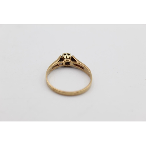 18 - A 9ct gold diamond solitaire ring, size R - approx. gross weight 2 grams