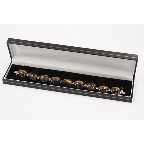 184 - A boxed 925 sterling silver tiger's eye oval link bracelet - approx. bracelet length 19cm