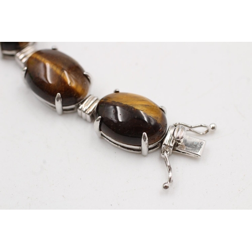 184 - A boxed 925 sterling silver tiger's eye oval link bracelet - approx. bracelet length 19cm