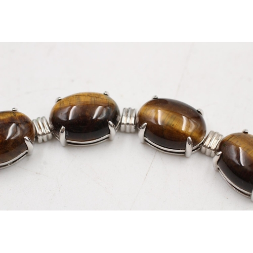 184 - A boxed 925 sterling silver tiger's eye oval link bracelet - approx. bracelet length 19cm