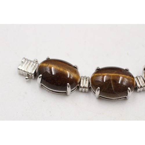 184 - A boxed 925 sterling silver tiger's eye oval link bracelet - approx. bracelet length 19cm