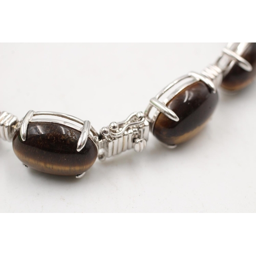 184 - A boxed 925 sterling silver tiger's eye oval link bracelet - approx. bracelet length 19cm