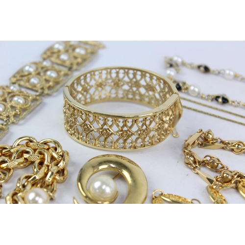 185 - Twenty pieces of 1980s jewellery to include enamel, faux pearl, gold tone etc.