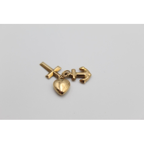 19 - Three 9ct gold charms/pendants to include bundle of love, hope and faith - approx. gross weight 2.2 ... 