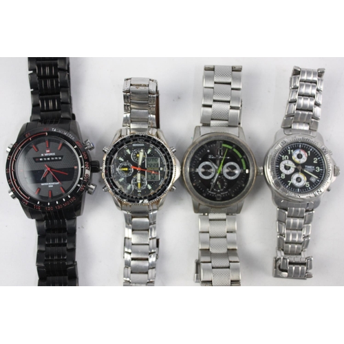 196 - Eight assorted gents sports chronograph wristwatches to include Fossil, Swatch etc.