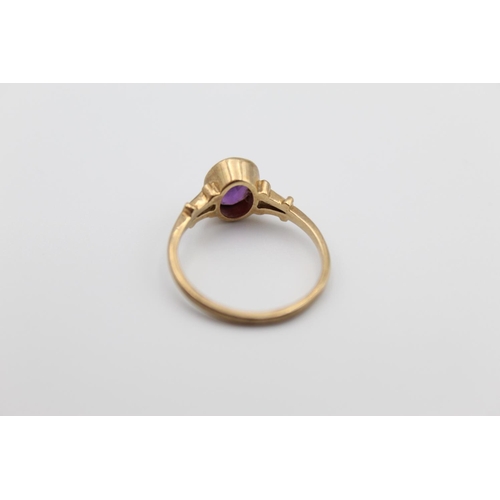 24 - A 9ct gold amethyst solitaire ring, size M - approx. gross weight 1.9 grams