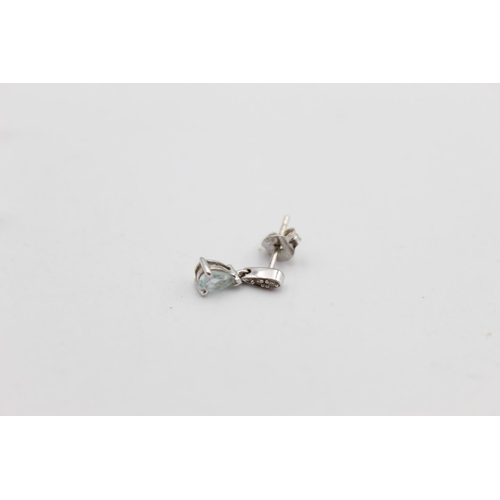 42 - A pair of 9ct white gold diamond and gemstone drop earrings - approx. gross weight 1 gram