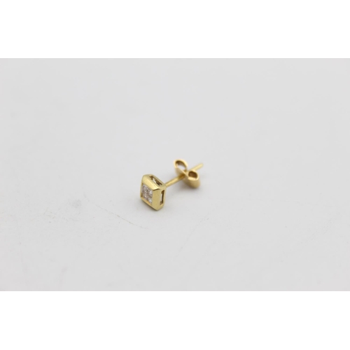 50 - A pair of 18ct gold diamond stud earrings - approx. gross weight 1.2 grams