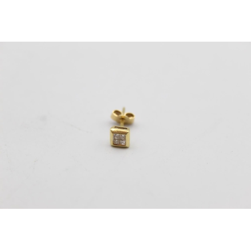 50 - A pair of 18ct gold diamond stud earrings - approx. gross weight 1.2 grams