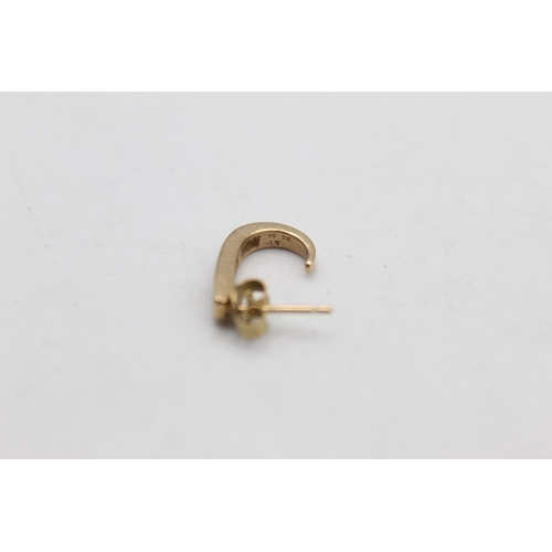 6 - A pair of 9ct gold calibre cut diamond half hoop stud earrings - approx. gross weight 2.5 grams