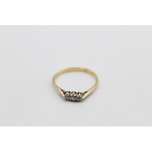 61 - An 18ct gold and platinum diamond trilogy ring, size R½ - approx. 2 grams