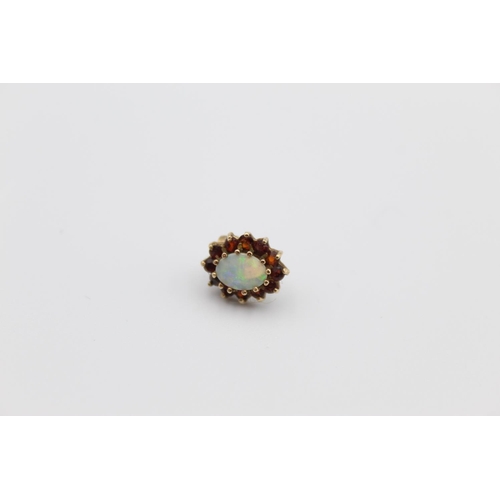 62 - A pair of 9ct gold opal and garnet halo stud earrings - approx. 1.7 grams