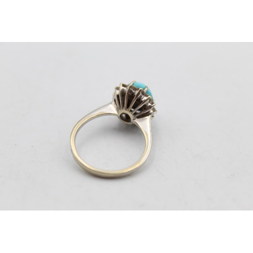 64 - A 12ct gold turquoise and diamond halo set ring, size L½ - approx. 4.2 grams