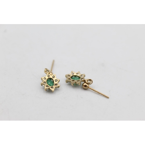 66 - A pair of 9ct gold emerald and gemstone halo drop earrings - approx. gross weight 1.1 grams