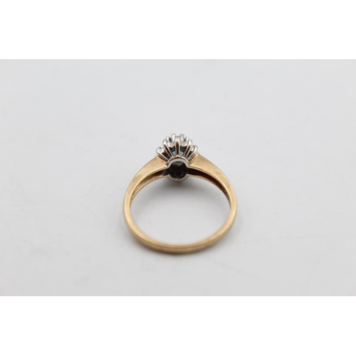 71 - A 9ct gold diamond and gemstone halo ring, size M - approx. gross weight 2.6 grams