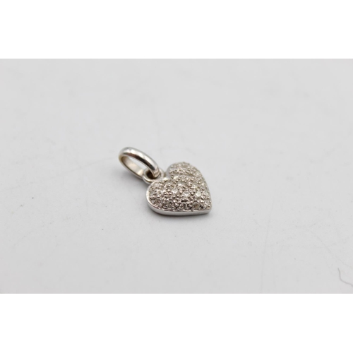 72 - A 14ct white gold diamond heart pendant - approx. gross weight 1.9 grams