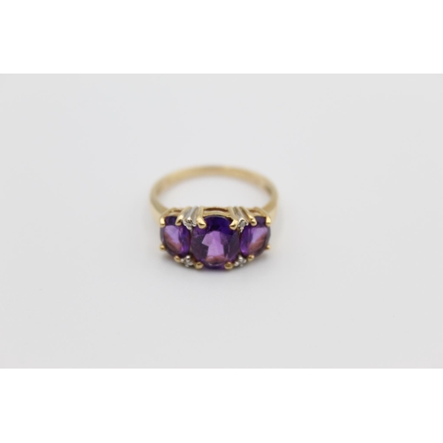 76 - A 10ct gold diamond and amethyst ring, size P - approx. gross weight 2.8 grams