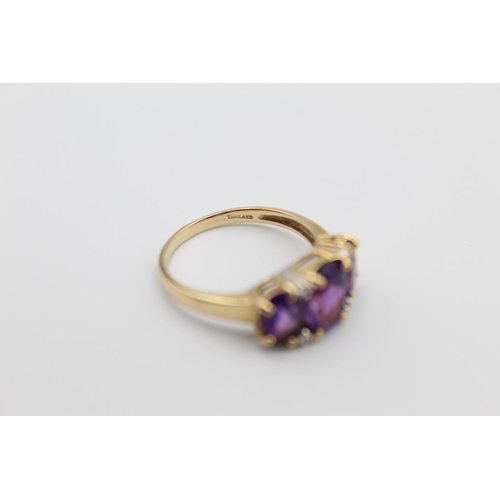 76 - A 10ct gold diamond and amethyst ring, size P - approx. gross weight 2.8 grams