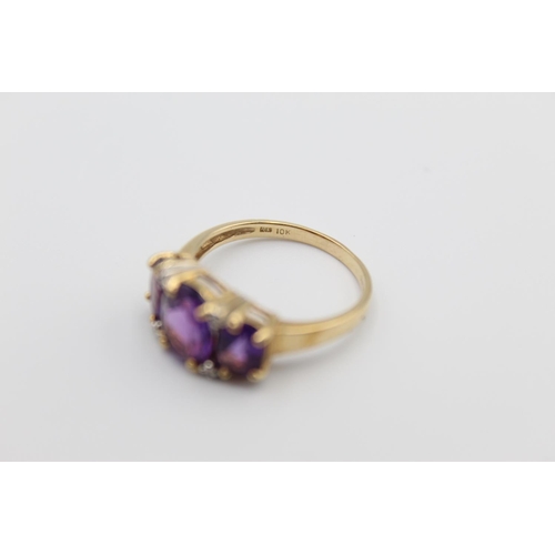 76 - A 10ct gold diamond and amethyst ring, size P - approx. gross weight 2.8 grams