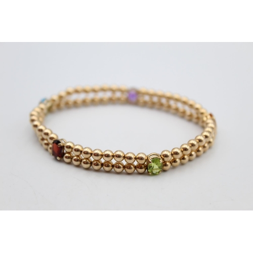 82 - A 9ct gold double row ball link gemstone set bracelet - approx. gross weight 3.8 grams