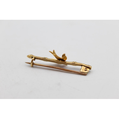 86 - An antique 9ct gold ruby and seed pearl swallow bird bar brooch - approx. gross weight 1.3 grams