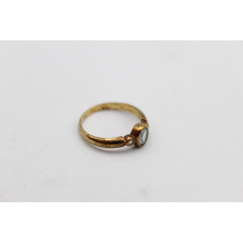 89 - A 9ct gold diamond and gemstone ring, size K - approx. gross weight 1.7 grams