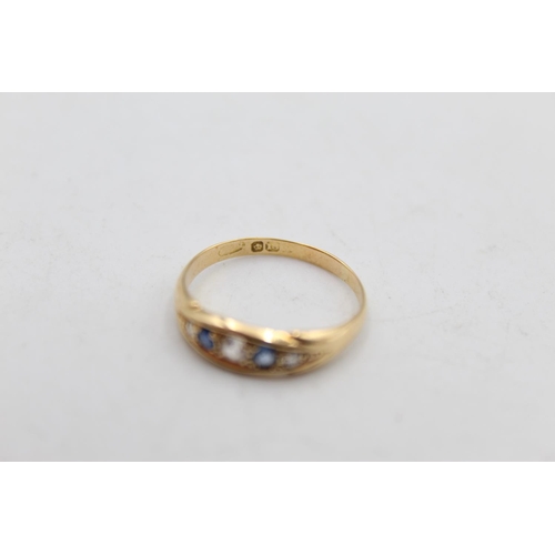 98 - An 18ct gold diamond and sapphire gypsy style ring, size Q - approx. gross weight 2.4 grams