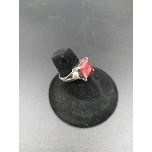 294 - A 925 silver and 4ct ruby ring with outer rose cut diamond accents - size M