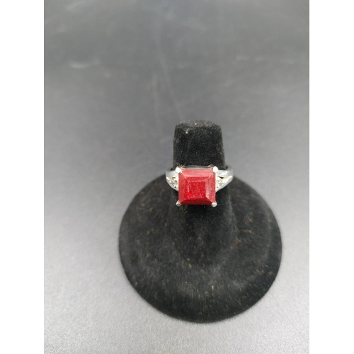 294 - A 925 silver and 4ct ruby ring with outer rose cut diamond accents - size M