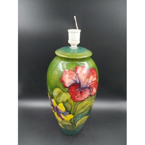 372 - A Moorcroft Hibiscus pattern table lamp - approx. 38cm high