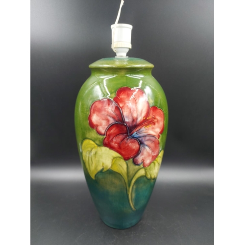 372 - A Moorcroft Hibiscus pattern table lamp - approx. 38cm high