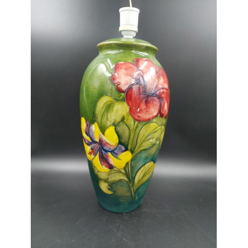 372 - A Moorcroft Hibiscus pattern table lamp - approx. 38cm high