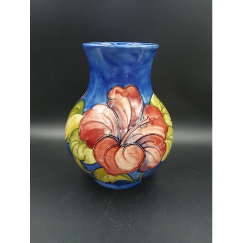 374 - A Moorcroft Hibiscus pattern vase - approx. 24cm high