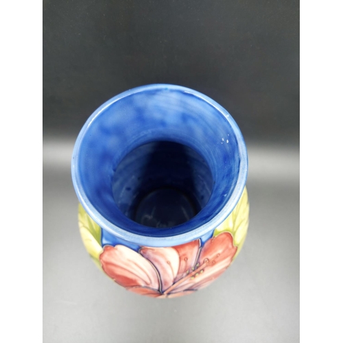 374 - A Moorcroft Hibiscus pattern vase - approx. 24cm high