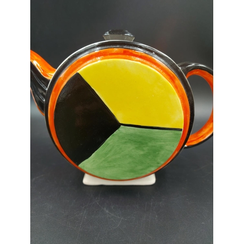 379 - An Art Deco style hand painted teapot in the manner of Clarice Cliff  - approx. 15cm high x 21cm lon... 