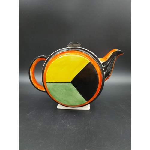 379 - An Art Deco style hand painted teapot in the manner of Clarice Cliff  - approx. 15cm high x 21cm lon... 