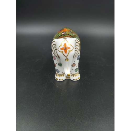 389 - A boxed Royal Crown Derby Infant Indian Elephant paperweight with gold stopper - approx. 7.5cm high ... 