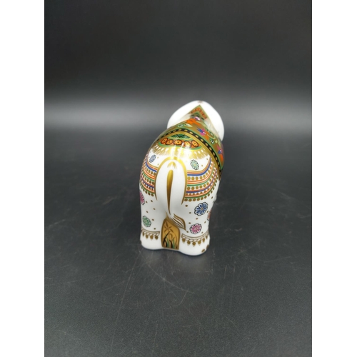 389 - A boxed Royal Crown Derby Infant Indian Elephant paperweight with gold stopper - approx. 7.5cm high ... 